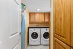 Laundry Room Features a Full Size Washer & Dryer